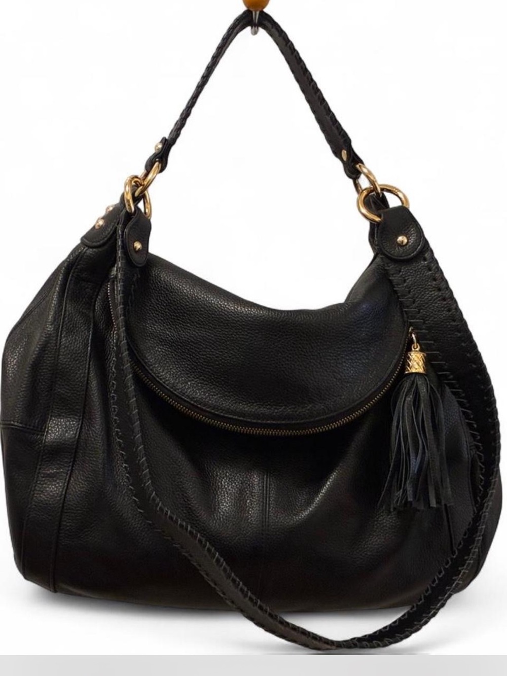 SOLD!

Onna Ehrlich Rachel Black Pebbled Leather Hobo with Tassel Detail.
